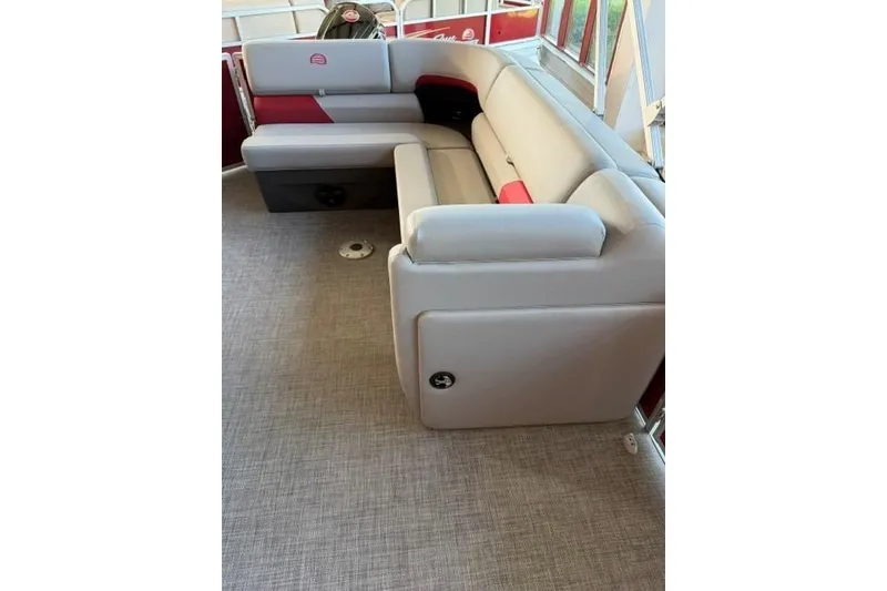 Slide: The Image of 2026 Sun Tracker Party Barge 20 DLX interior with plush seating and modern design. - 9