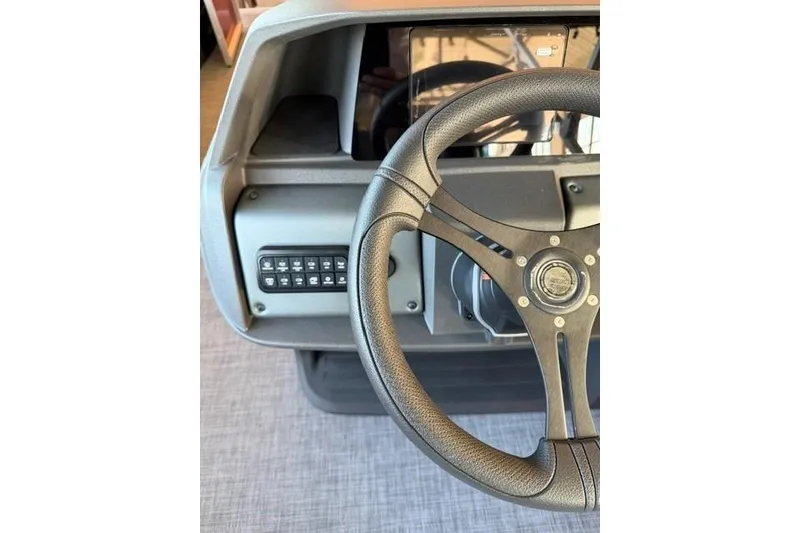 Slide: The Image of Steering wheel and dashboard of 2026 Sun Tracker Party Barge 20 DLX pontoon boat. - 13