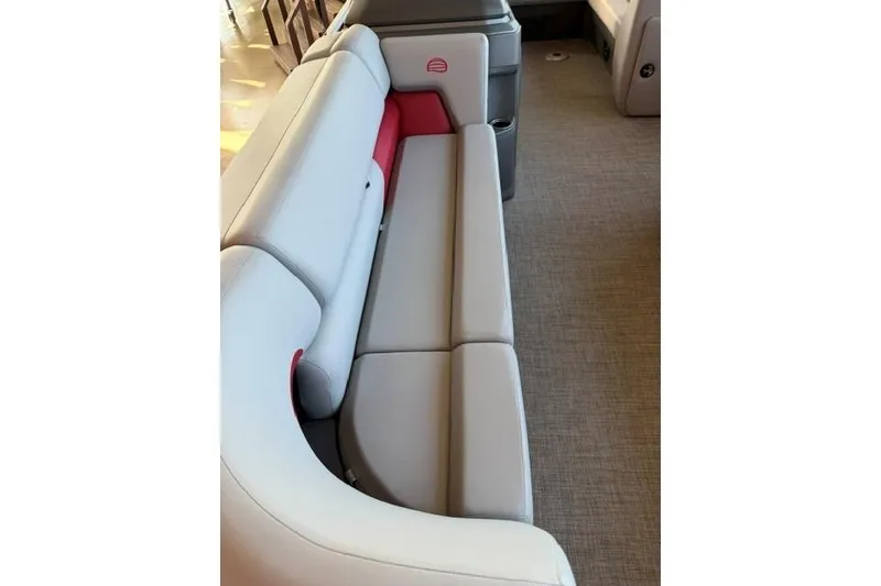 Slide: The Image of 2026 Sun Tracker Party Barge 20 DLX interior seating with gray and red upholstery. - 5