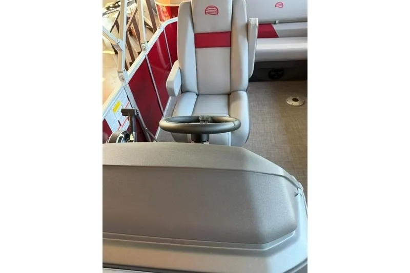 Slide: The Image of Captain's seat and steering wheel of 2026 Sun Tracker Party Barge 20 DLX pontoon boat. - 12