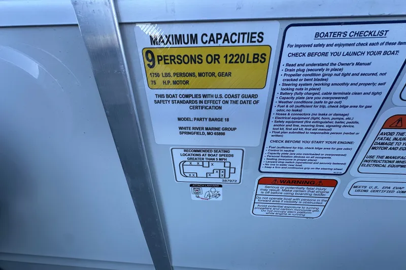 Slide: The Image of 2026 Sun Tracker Party Barge 18 DLX capacity and safety information label. - 34