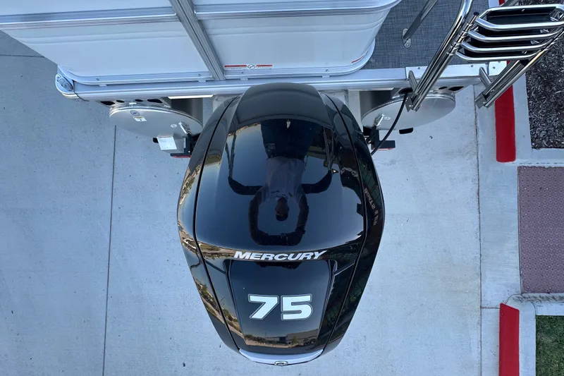 Slide: The Image of Overhead view of a 2026 Sun Tracker Party Barge 18 DLX with Mercury 75 outboard motor. - 35
