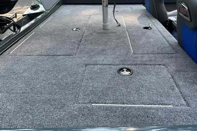 Slide: The Image of 2026 Ranger RT178 boat deck with gray carpet and storage compartments. - 5