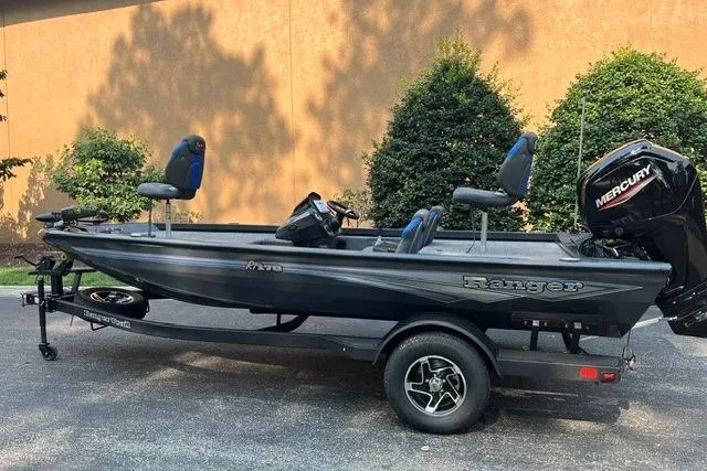 Slide: The Image of 2026 Ranger RT178 fishing boat with Mercury engine on trailer, parked outdoors. - 1