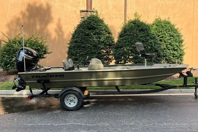 The Image of 2026 Tracker Grizzly 1754 SC boat on trailer, parked outdoors. - 0