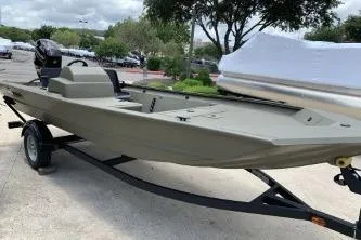 Slide: The Image of 2026 Tracker Grizzly 1754 SC boat on trailer, parked outdoors. - 4