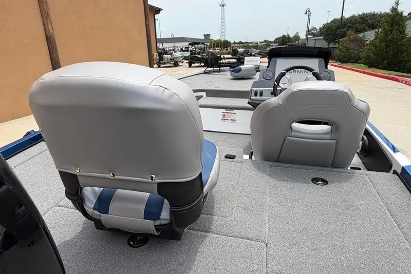 Slide: The Image of 2026 Nitro Z18 Pro boat interior with gray seating and Garmin dashboard. - 7