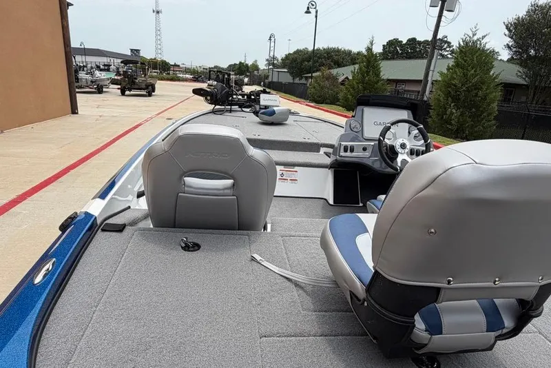 Slide: The Image of 2026 Nitro Z18 Pro boat interior with gray seating and advanced dashboard controls. - 6