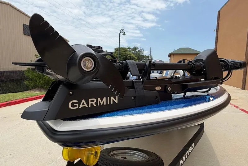 Slide: The Image of Garmin trolling motor on 2026 Nitro Z18 Pro boat, parked outdoors. - 11