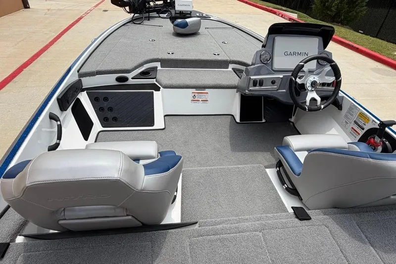 Slide: The Image of 2026 Nitro Z18 Pro boat interior with Garmin navigation system and plush seating. - 12