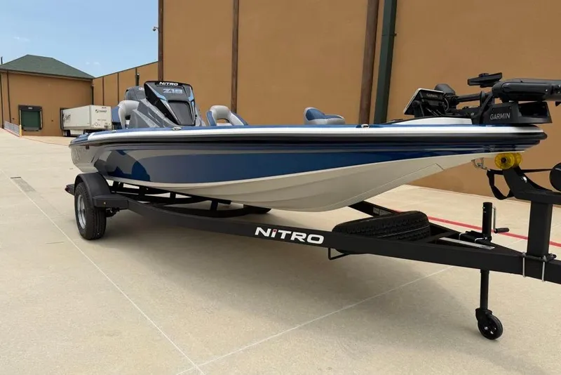 Slide: The Image of 2026 Nitro Z18 Pro boat on trailer, featuring sleek blue and white design. - 2