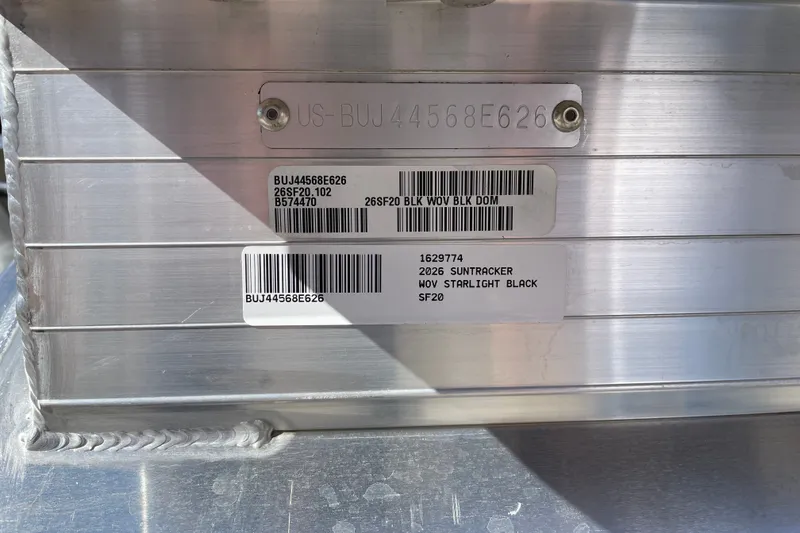 Slide: The Image of 2026 Sun Tracker SportFish 20 DLX identification plate with serial numbers and model details. - 111