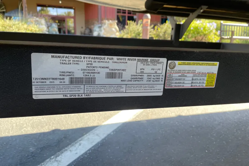 Slide: The Image of Label on Sun Tracker SportFish 20 DLX trailer, manufactured by White River Marine Group. - 113