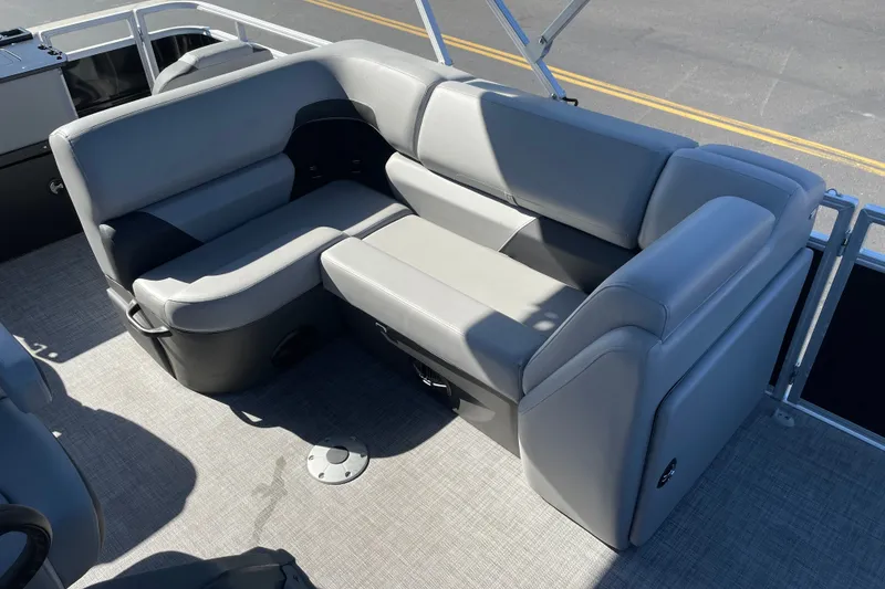 Slide: The Image of 2026 Sun Tracker SportFish 20 DLX pontoon boat with gray seating and spacious interior. - 13