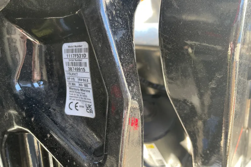 Slide: The Image of Close-up of a Mercury Marine engine label on a 2026 Sun Tracker SportFish 20 DLX. - 112