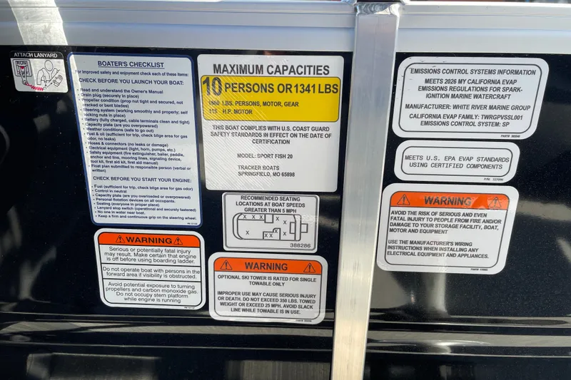 Slide: The Image of Warning and safety labels on a 2026 Sun Tracker SportFish 20 DLX boat. - 18