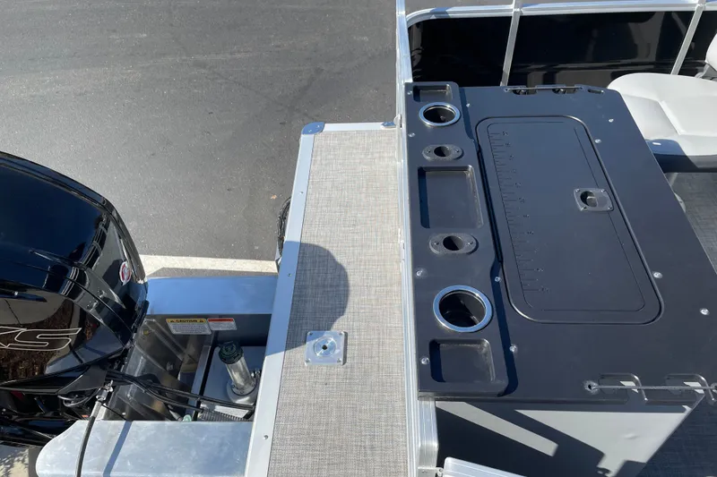 Slide: The Image of 2026 Sun Tracker SportFish 20 DLX boat with motor and fishing station. - 21