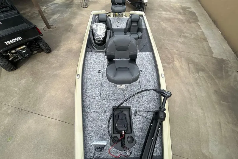 Slide: The Image of 2026 Tracker Pro Team 190 boat interior with seating and equipment on display. - 16