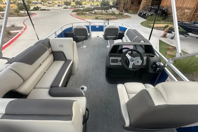 Slide: The Image of 2026 Sun Tracker Fishin' Barge 20 DLX interior with plush seating and modern helm. - 55