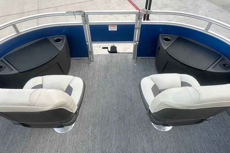 Slide: The Image of 2026 Sun Tracker Fishin' Barge 20 DLX interior with seating and cup holders. - 59