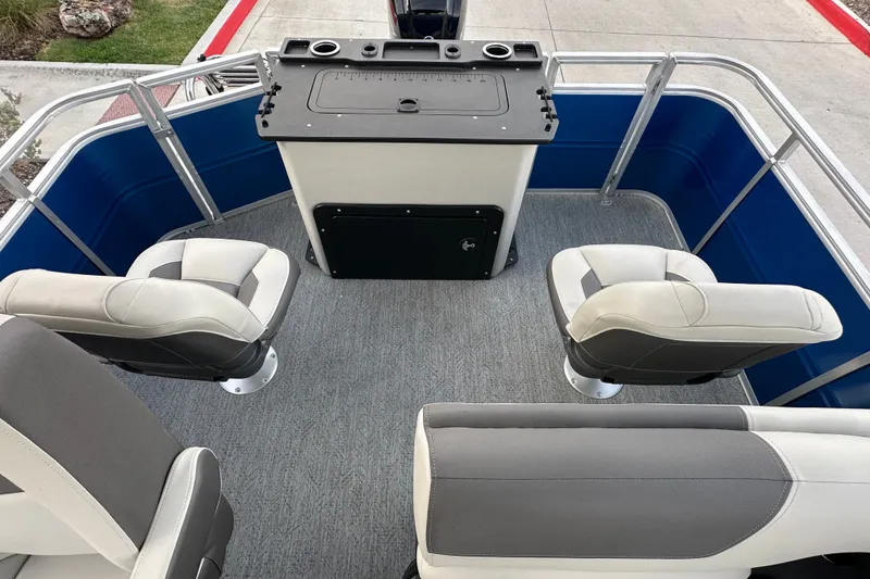 Slide: The Image of 2026 Sun Tracker Fishin' Barge 20 DLX interior with seating and fishing station. - 52