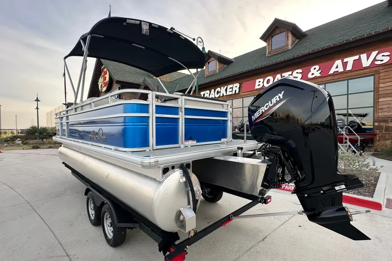 Slide: The Image of 2026 Sun Tracker Fishin' Barge 20 DLX pontoon boat with Mercury engine at dealership. - 48