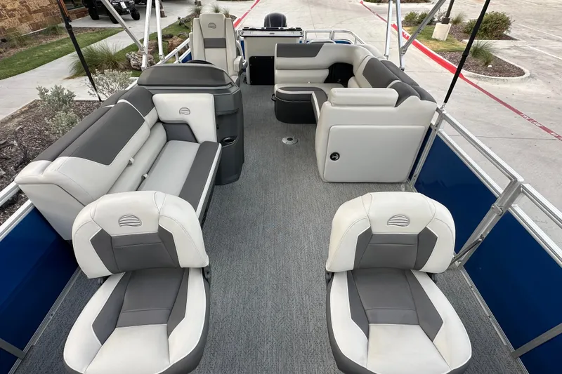 Slide: The Image of 2026 Sun Tracker Fishin' Barge 20 DLX interior with spacious seating and modern design. - 49