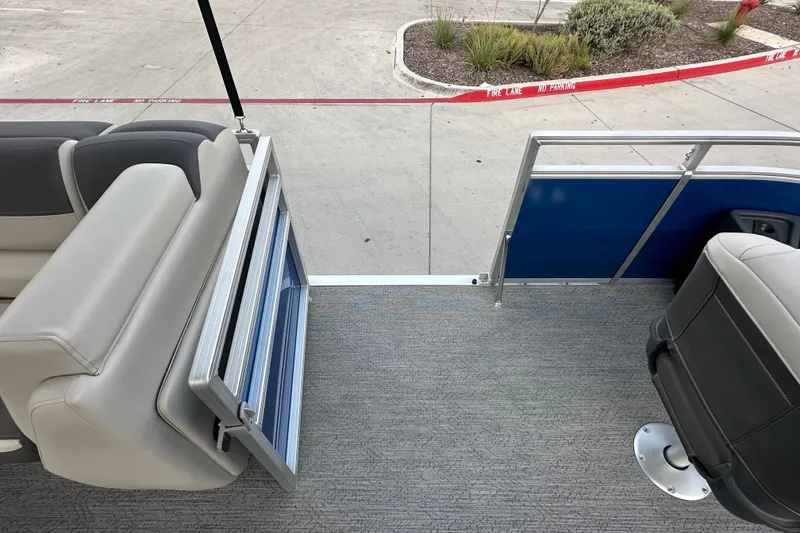 Slide: The Image of 2026 Sun Tracker Fishin' Barge 20 DLX interior with seating and open gate. - 50