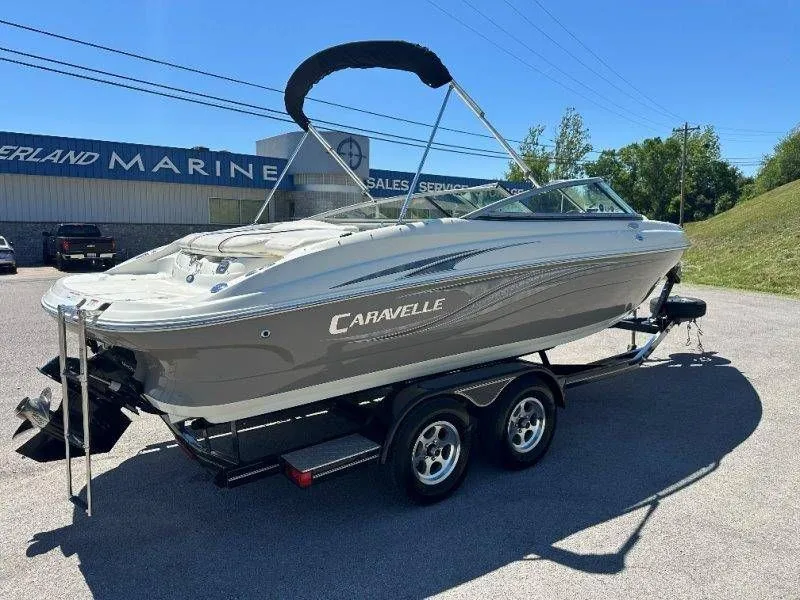 Slide: The Image of 2009 Caravelle 237 boat on trailer at marine dealership. - 10