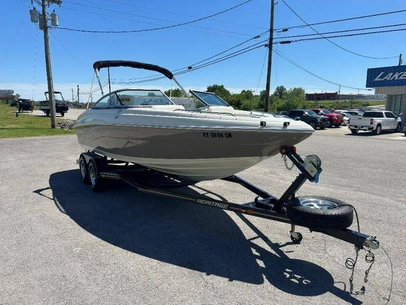 Slide: The Image of 2009 Caravelle 237 boat on trailer parked outdoors. - 17