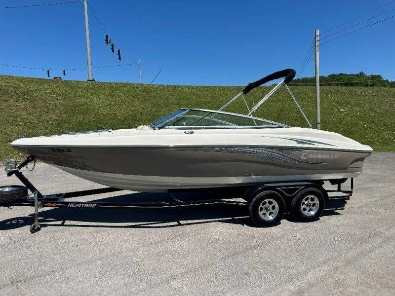 Slide: The Image of 2009 Caravelle 237 boat on trailer in sunny weather. - 19