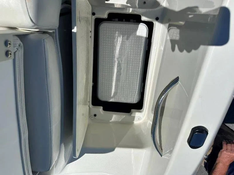 Slide: The Image of Interior of a 2009 Caravelle 237 boat with storage compartment. - 23