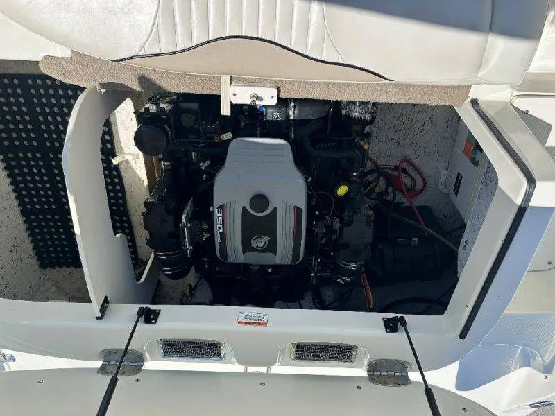 Slide: The Image of Engine compartment of a 2009 Caravelle 237 boat with open hatch. - 24