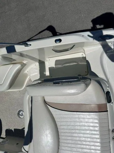 Slide: The Image of Interior of a 2009 Caravelle 237 boat with white upholstery. - 25