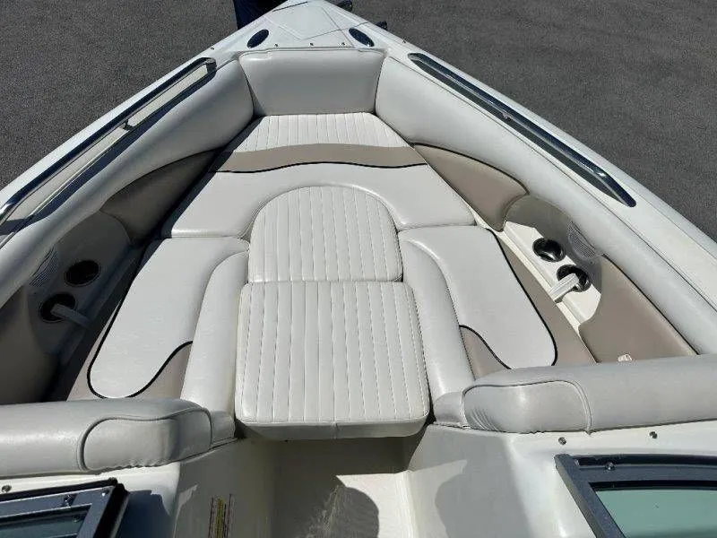 Slide: The Image of Interior of a 2009 Caravelle 237 boat with white upholstery. - 26