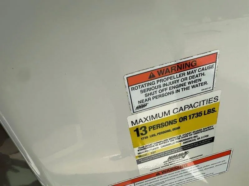 Slide: The Image of Warning label on Caravelle 237 boat, maximum capacity 13 persons, year 2009. - 27