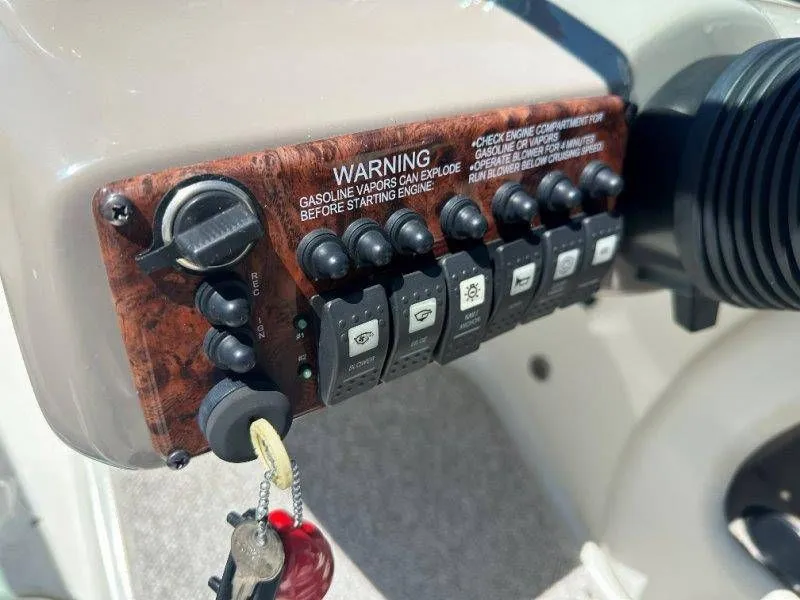 Slide: The Image of Control panel of a 2009 Caravelle 237 boat with warning labels. - 28