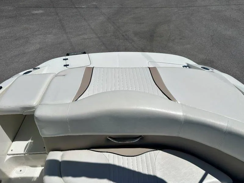 Slide: The Image of Rear view of a 2009 Caravelle 237 boat with white upholstery. - 29