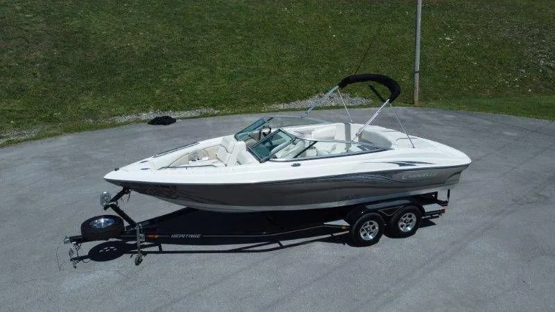 Slide: The Image of 2009 Caravelle 237 boat on trailer, side view. - 3