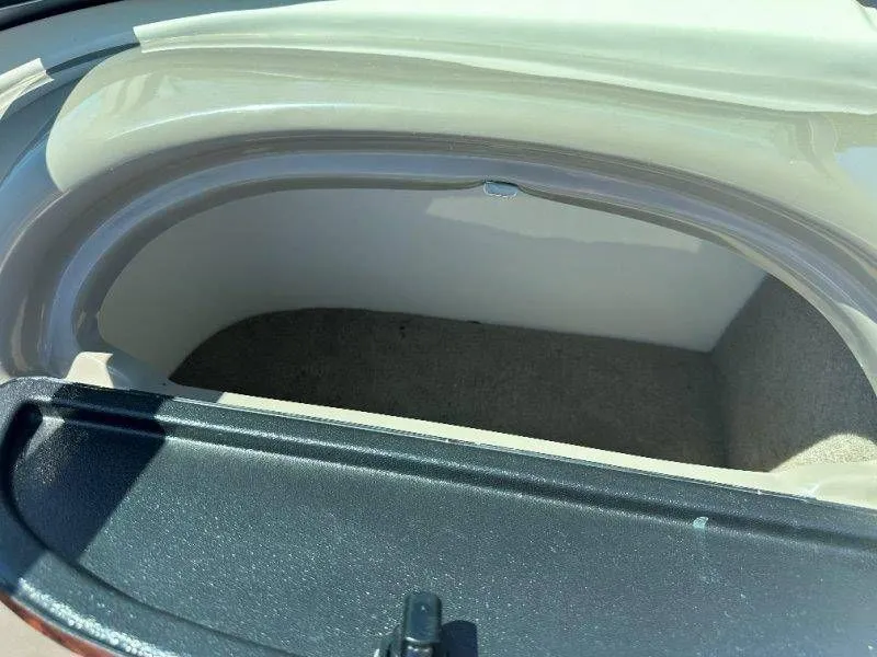 Slide: The Image of Interior of a 2009 Caravelle 237, empty storage compartment. - 35