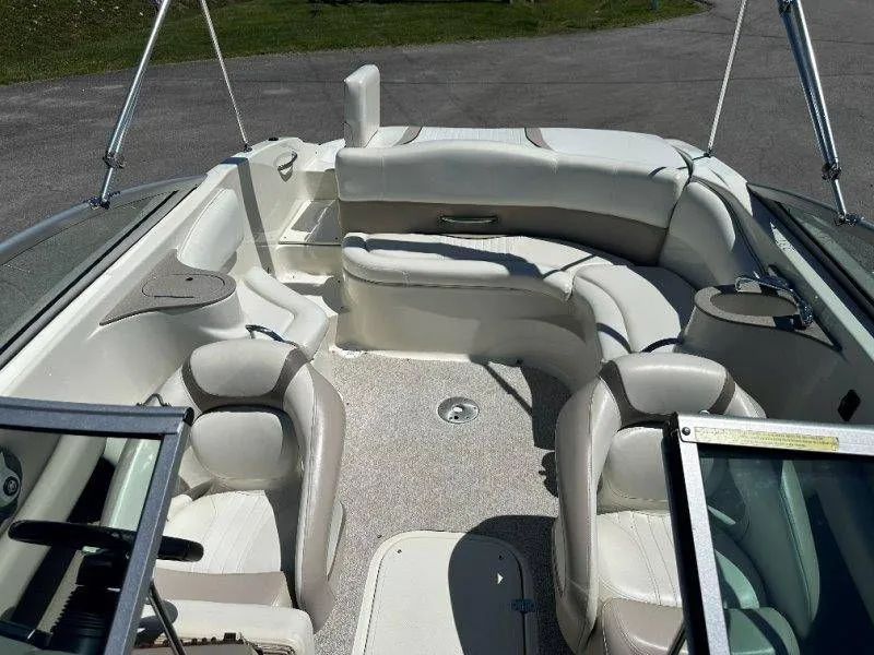 Slide: The Image of 2009 Caravelle 237 boat interior with white seating. - 38