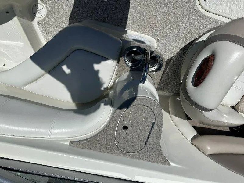 Slide: The Image of Interior of a 2009 Caravelle 237 boat with white leather seats. - 40
