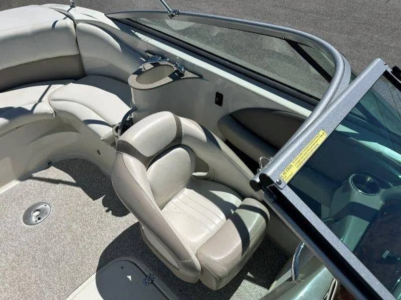 Slide: The Image of Interior of a 2009 Caravelle 237 boat with beige leather seats. - 41