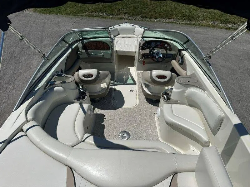 Slide: The Image of Interior of a 2009 Caravelle 237 boat with beige seating. - 42