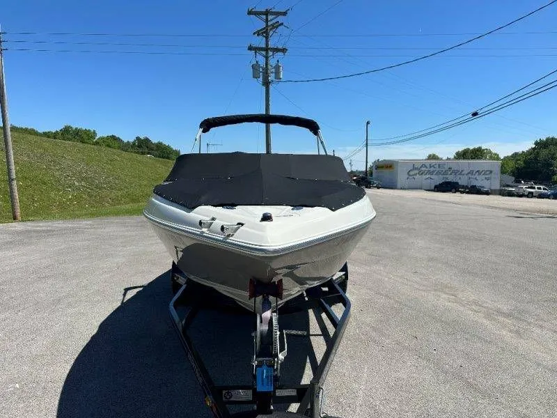 Slide: The Image of 2009 Caravelle 237 boat on trailer, parking lot view. - 43
