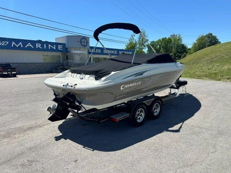 Slide: The Image of 2009 Caravelle 237 boat on trailer outside marine shop. - 46