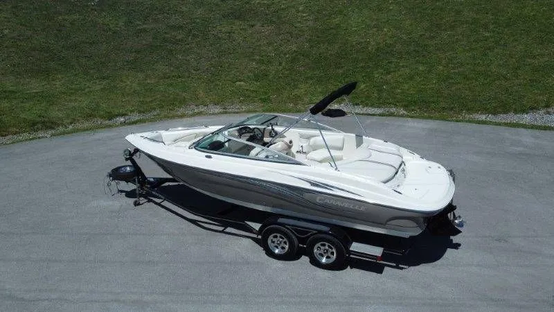 Slide: The Image of 2009 Caravelle 237 boat on trailer, side view. - 5