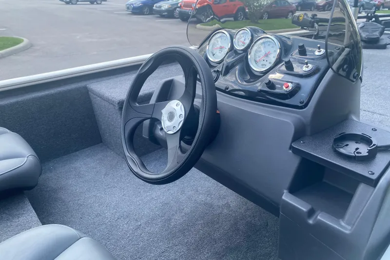 Slide: The Image of Steering console of 2026 Tracker Pro 170 boat with gauges and controls. - 4