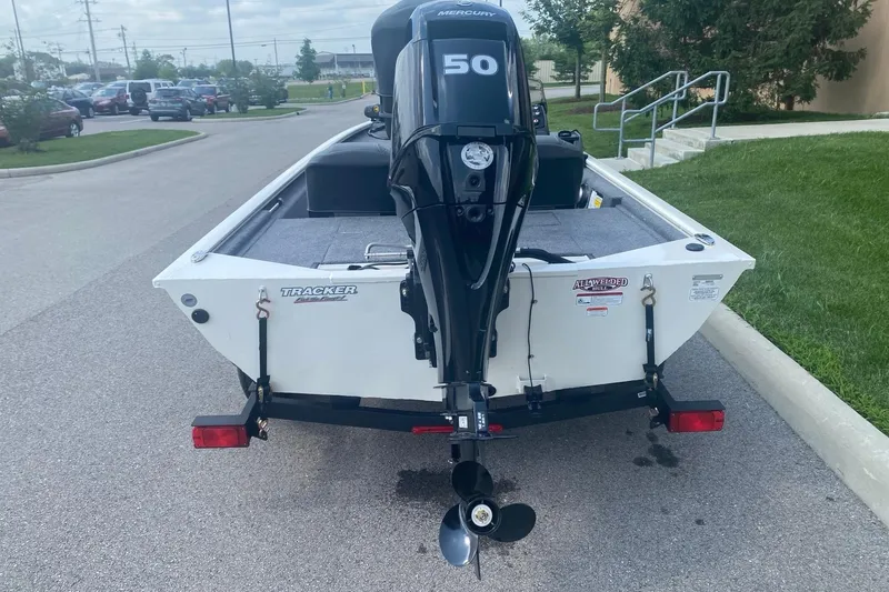 Slide: The Image of 2026 Tracker Pro 170 boat with Mercury 50 engine on trailer, parked outdoors. - 5