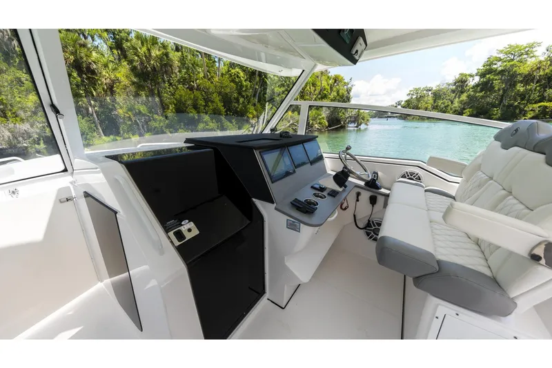 Slide: The Image of Interior view of a 2026 Edgewater boat with modern controls and luxurious seating. - 10